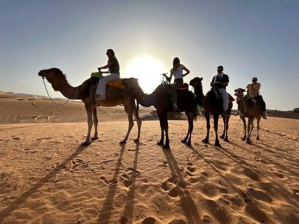 family camel ride morocco desert